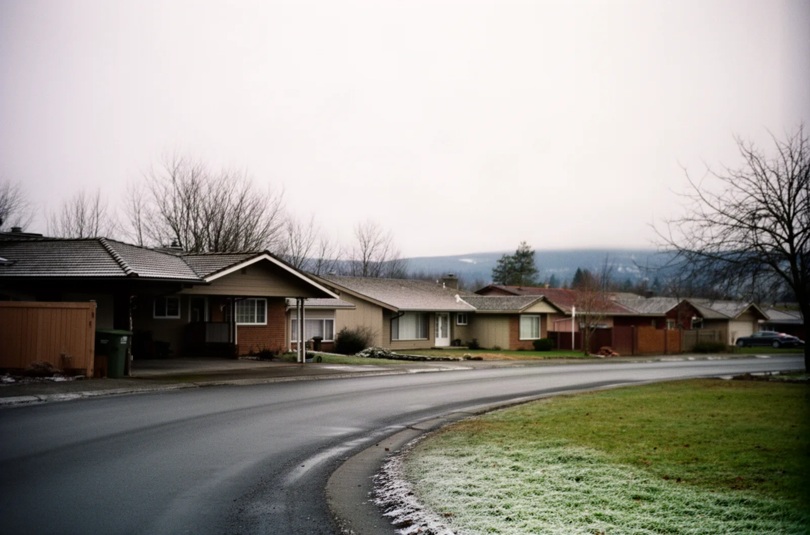 A ranch subdivision street in Gresham under flat winter skies