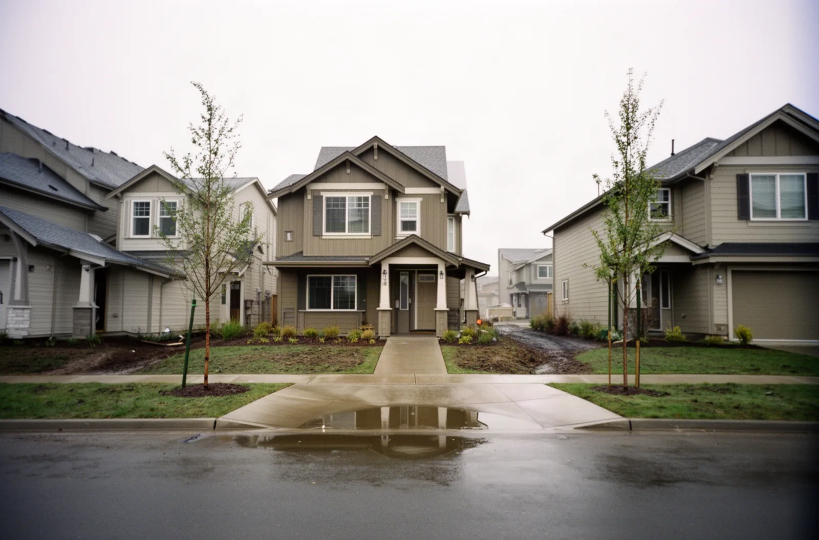 Newer subdivision houses on a wet street in Hillsboro